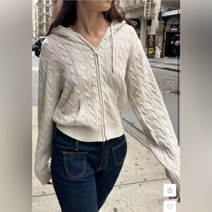 Brandy Melville “Ayla Cable Knit Zip-Up Sweater” in cream